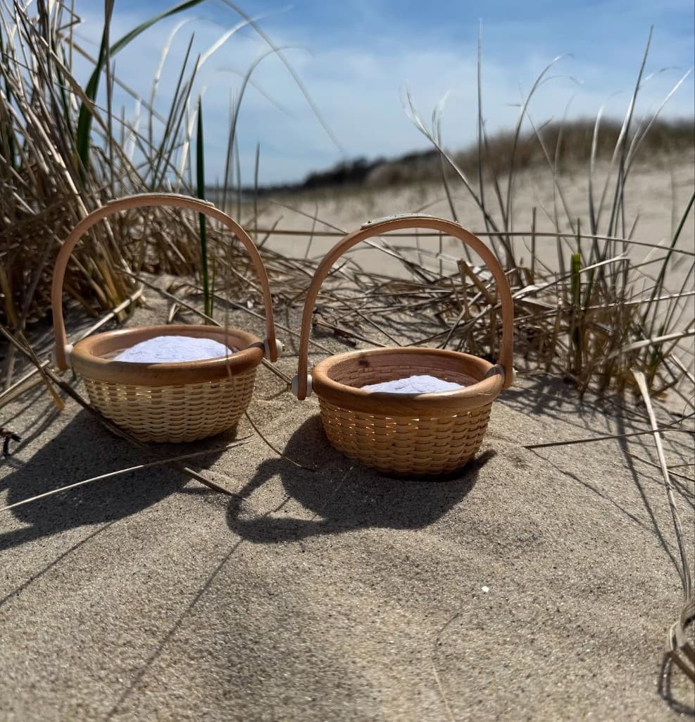 Pair of Nantucket baskets on Cape Cod beach dunes