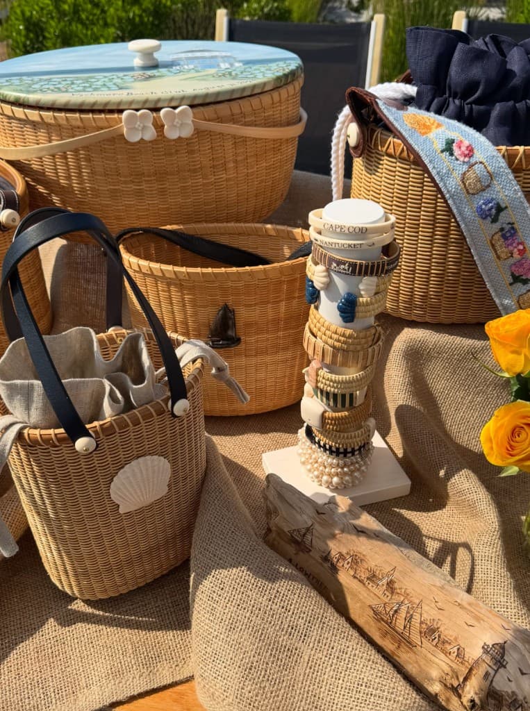 Assortment of Chatham Weaves baskets, bracelets, and jewelry at a pop-up display
